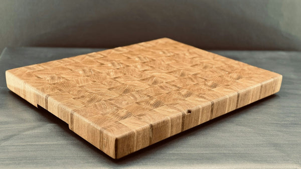 Wooden end-grain cutting board with visible block grain pattern