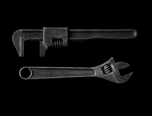 Two metal hand tools illustrating lever mechanics