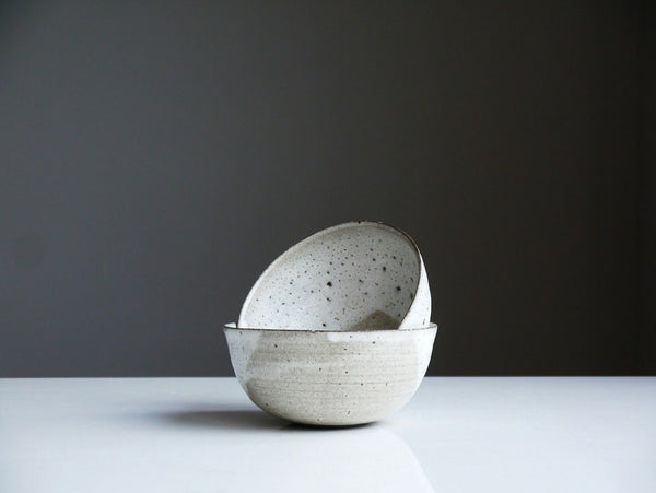 Handmade white-glazed ceramic bowls illustrating the thick pale glaze associated with Shino-style tea ceramics
