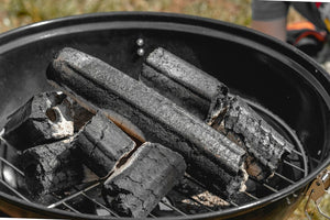 Kettle over burning charcoal used as a general fire-and-kettle reference; not a verified chanoyu furo