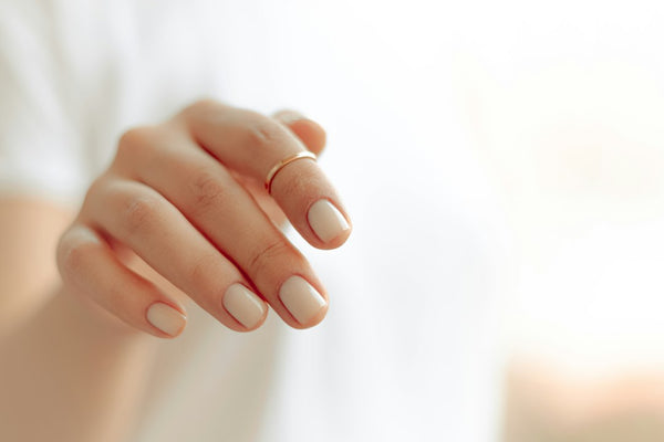 A hand with neatly trimmed nails