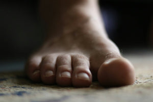 Close-up of a bare foot indoors