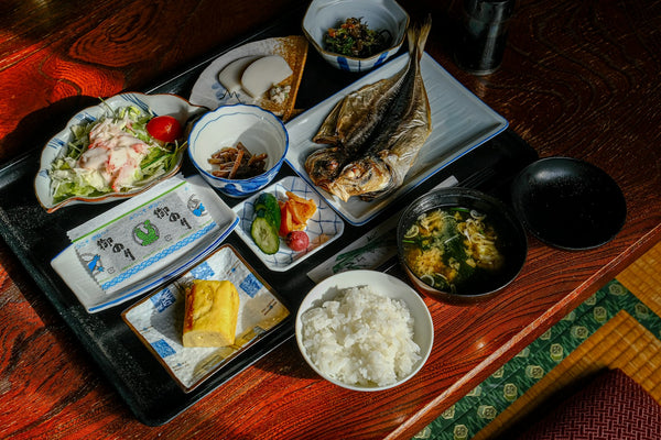 Japanese meal arranged on a tray, illustrating the food course of a formal tea gathering