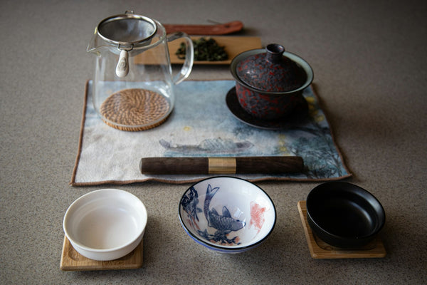 Tea vessels and serving dishes arranged together on a table