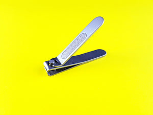 A precision hand cutting tool on a bright surface