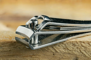A close-up of a precision metal cutting tool on wood