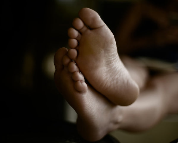 Close-up of bare feet in natural light