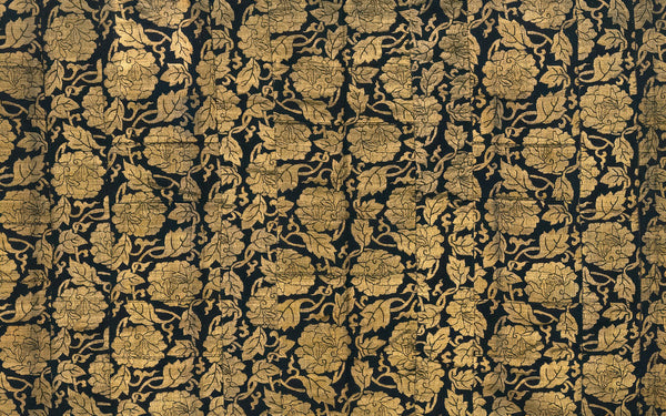 Historic Japanese patterned silk textile in black and gold, illustrating the brocade textile world of kobukusa