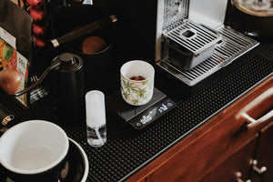 Brewed coffee on a digital scale during preparation
