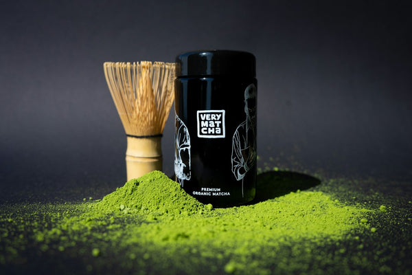 Contemporary bamboo matcha whisk with matcha powder used as a chasen reference