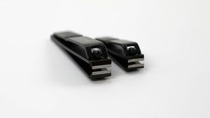 Two nail clippers on a white background