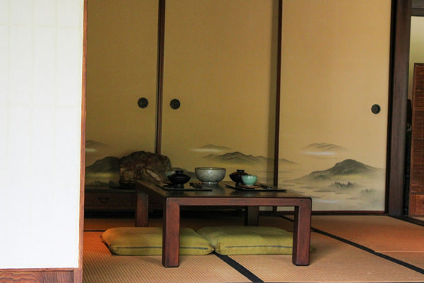 Traditional Japanese tea ceremony setting in a tatami room
