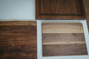 Three wooden cutting boards with different grain patterns