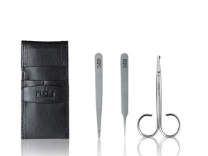 A set of three silver metal beauty tools, including tweezers, a spatula, and a loop tool, displayed next to a black leather card holder case on a reflective white background. The brand name 'rubie' is embossed on the case and engraved on the tools.